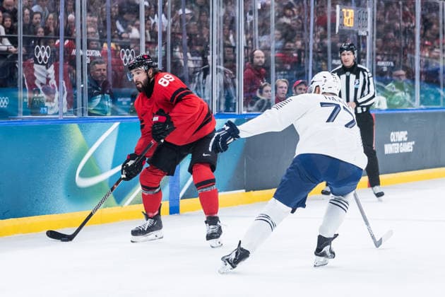 MILANO, ITALY - FEBRUARY 15: Drew Doughty (Canada, 89) controls the puck against Sacha Treille (France, 77) during the Ice hockey, Eishockey Men Canada vs France - Preliminary Round - Group A at the Milano Cortina 2026 Olympics at Milano Santagiulia Ice Hockey Arena on day 9 of the Milano Cortina 2026 Olympics on February 15, 2026 in Milano, Italy. Editorial use only. Italy Copyright: xSteffiexWunderlx
