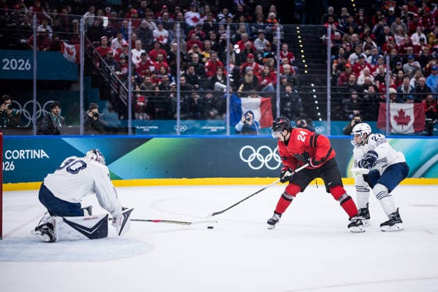 MILANO, ITALY - FEBRUARY 15: Antoine Keller (France, 30), Seth Jarvis (Canada, 24) controls the puck against Jules Boscq (France, 27) during the Ice hockey, Eishockey Men Canada vs France - Preliminary Round - Group A at the Milano Cortina 2026 Olympics at Milano Santagiulia Ice Hockey Arena on day 9 of the Milano Cortina 2026 Olympics on February 15, 2026 in Milano, Italy. Editorial use only. Italy Copyright: xSteffiexWunderlx