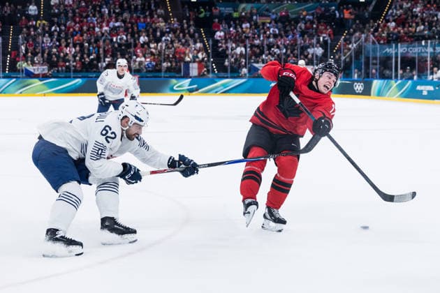 MILANO, ITALY - FEBRUARY 15: Florian Chakiachvili (France, 62) and Macklin Celebrini (Canada, 17) fight for the puck during the Ice hockey, Eishockey Men Canada vs France - Preliminary Round - Group A at the Milano Cortina 2026 Olympics at Milano Santagiulia Ice Hockey Arena on day 9 of the Milano Cortina 2026 Olympics on February 15, 2026 in Milano, Italy. Editorial use only. Italy Copyright: xSteffiexWunderlx