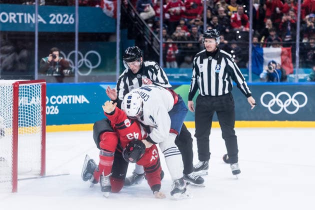MILANO, ITALY - FEBRUARY 15: Tom Wilson (Canada, 43) and Pierre Crinon (France, 7) start a fight are fighting during the Ice hockey, Eishockey Men Canada vs France - Preliminary Round - Group A at the Milano Cortina 2026 Olympics at Milano Santagiulia Ice Hockey Arena on day 9 of the Milano Cortina 2026 Olympics on February 15, 2026 in Milano, Italy. Editorial use only. Italy Copyright: xSteffiexWunderlx