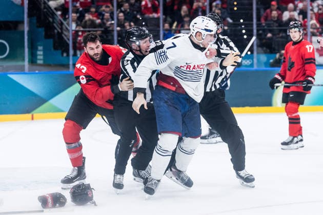 MILANO, ITALY - FEBRUARY 15: Tom Wilson (Canada, 43) and Pierre Crinon (France, 7) start a fight are fighting during the Ice hockey, Eishockey Men Canada vs France - Preliminary Round - Group A at the Milano Cortina 2026 Olympics at Milano Santagiulia Ice Hockey Arena on day 9 of the Milano Cortina 2026 Olympics on February 15, 2026 in Milano, Italy. Editorial use only. Italy Copyright: xSteffiexWunderlx