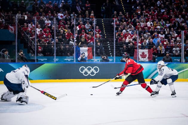 MILANO, ITALY - FEBRUARY 15: Seth Jarvis (Canada, 24) controls the puck against Jules Boscq (France, 27) during the Ice hockey, Eishockey Men Canada vs France - Preliminary Round - Group A at the Milano Cortina 2026 Olympics at Milano Santagiulia Ice Hockey Arena on day 9 of the Milano Cortina 2026 Olympics on February 15, 2026 in Milano, Italy. Editorial use only. Italy Copyright: xSteffiexWunderlx