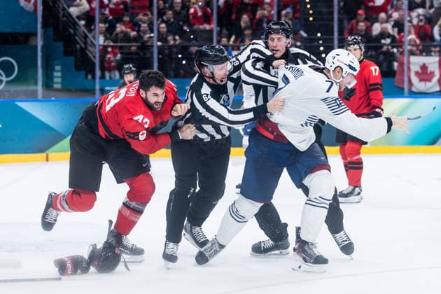 MILANO, ITALY - FEBRUARY 15: Tom Wilson (Canada, 43) and Pierre Crinon (France, 7) start a fight are fighting during the Ice hockey, Eishockey Men Canada vs France - Preliminary Round - Group A at the Milano Cortina 2026 Olympics at Milano Santagiulia Ice Hockey Arena on day 9 of the Milano Cortina 2026 Olympics on February 15, 2026 in Milano, Italy. Editorial use only. Italy Copyright: xSteffiexWunderlx