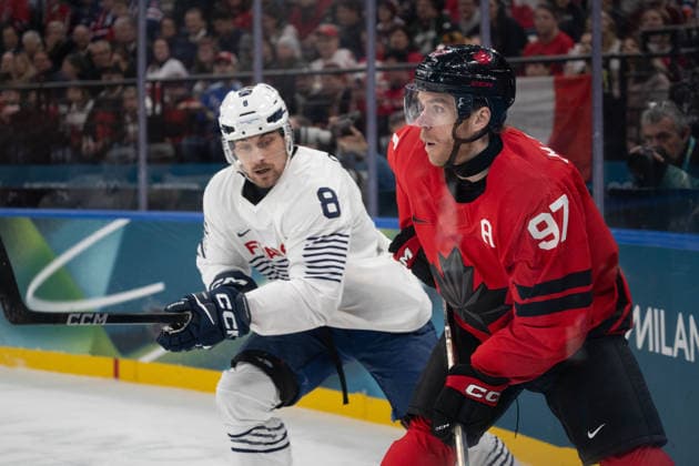 Connor McDavid (Canada, 97) and Hugo Gallet (France, 8) in action during the Menss Ice hockey, Eishockey group stage game between Canada and France at the Olympic Winter games, Winterspiele,Spiele, Summer games Milano Cortina 2026 at the Milano Santa Giulia Ice Hockey Arena, Milan, Italy, on February 15, 2026. im Gruppenspiel der Männer im Eishockey zwischen Kanada und Frankreich bei den Olympischen Winterspielen Milano Cortina 2026 in der Milano Santa Giulia Ice Hockey Arena, Mailand, Italien, am 15. Februar 2026. *** Connor McDavid Canada, 97 and Hugo Gallet France, 8 in action during the Mens ice hockey group stage game between Canada and France at the Olympic Winter Games Milano Cortina 2026 at the Milano Santa Giulia Ice Hockey Arena, Milan, Italy, on February 15, 2026 in the Mens ice hockey group stage game between Canada and France at the Olympic Winter Games Milano Cortina 2026 at the Milano Santa Giulia Ice Hockey Arena, Milan, Italy, on February 15, 2026 Copyright: HMBxMedia MarcxNiemeyer