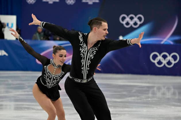 Karina Akopova and Nikita Rakhmanin of Armenia skate together during the Pairs Figure skating, Eiskunstlauf Short Program at the Milano Figure Skating Arena in Milan, Italy on Sunday, February 15, 2026.  OLY20260215102 RichardxEllis