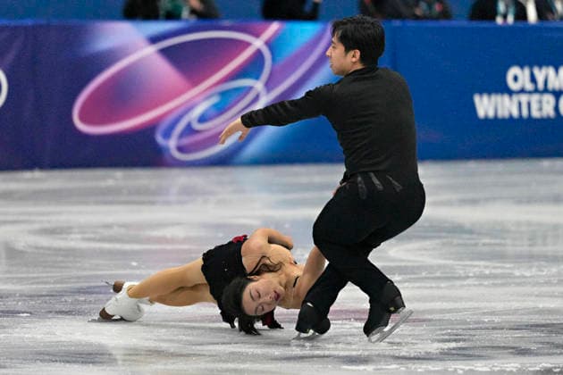 Wenjing Sui and Cong Han of China, perform their routine during the Pairs Figure skating, Eiskunstlauf Short Program at the Milano Figure Skating Arena in Milan, Italy on Sunday, February 15, 2026.  OLY20260215106 RichardxEllis