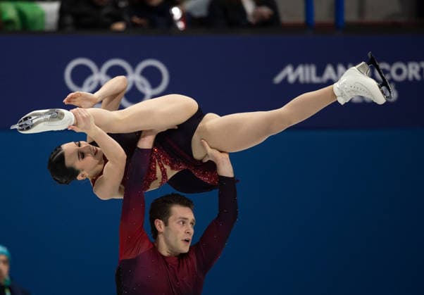 February 15, 2026, Milano, Lombardy, Italy: Lia Pereira (9-1) of Canada and Trennt Michaud (9-2) of Canada perform in Ice Skating Pairs Short Program during the 2026 Winter Olympics at the Milano Ice Skating Arena on Sunday in Milano. Milano Italy - ZUMAj89_ 20260215_oly_j89_026 Copyright: xPaulxKitagakixJr.x