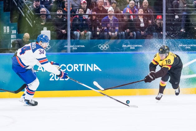 MILANO, ITALY - FEBRUARY 15: Auston Matthews (United States of America, 34) and Tim Stuetzle (Germany, 18) battle for the puck during the Ice hockey, Eishockey Men United States of America vs Germany - Preliminary Round - Group C at the Milano Cortina 2026 Olympics at Milano Santagiulia Ice Hockey Arena on day 9 of the Milano Cortina 2026 Olympics on February 15, 2026 in Milano, Italy. Editorial use only. Italy Copyright: xSteffiexWunderlx