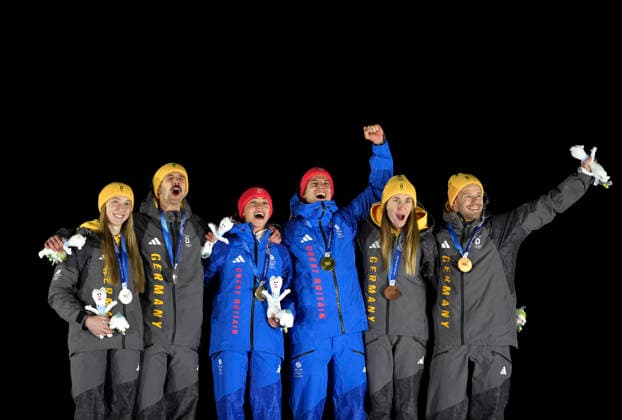(260215) -- CORTINA D AMPEZZO, Feb. 15, 2026 -- Gold medalists Tabitha Stoecker Matt Weston of Britain, silver medalists Susanne Kreher Axel Jungk of Germany and bronze medalists Jacqueline Pfeifer Christopher Grotheer of Germany pose for photos during the awarding ceremony of the skeleton mixed team competition at the Milan-Cortina 2026 Olympic Winter games, Winterspiele,Spiele, Summer games in Cortina, Italy, Feb. 15, 2026. ) (MICO2026)ITALY-CORTINA D AMPEZZO-OLYMPIC WINTER GAMES-SKELETON MIXED TEAM LixGang 