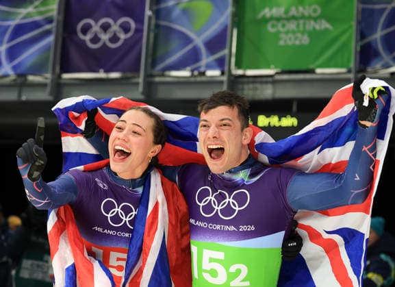 (260215) -- CORTINA D AMPEZZO, Feb. 15, 2026 -- Tabitha Stoecker (L) Matt Weston of Britain celebrate after the skeleton mixed team competition at the Milan-Cortina 2026 Olympic Winter games, Winterspiele,Spiele, Summer games in Cortina, Italy, Feb. 15, 2026. ) (MICO2026)ITALY-CORTINA D AMPEZZO-OLYMPIC WINTER GAMES-SKELETON MIXED TEAM DingxXu 