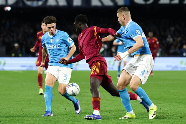 Miguel Gutierrez of SSC Napoli, Robinio Vaz of AS Roma and Alessandro Buongiorno of SSC Napoli compete for the ball during the Serie A 2025 2026 football match between SSC Napoli and AS Roma at Diego Armando Maradona stadium in Naples (Italy), February 15, 2026. cesarexpurini
