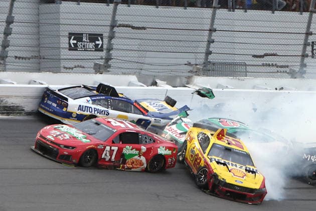 DAYTONA BEACH, FL - FEBRUARY 15: Tyler Reddick ( 45 23XI Racing Chumba Casino Toyota) leads to the checkered flag as Riley Herbst ( 35 23XI Racing Blind Lemon Toyota), Joey Logano ( 22 Team Penske Shell Pennzoil Ford) and Chase Elliott ( 9 Hendrick Motorsports Napa Auto Parts Chevrolet) crash behind him during the running of the 68th NASCAR, Motorsport, USA Cup Series Daytona 500 on February 15, 2026 at Daytona International Speedway in Daytona Beach, FL. (Photo by Jeff Robinson Icon Sportswire) AUTO: FEB 15 NASCAR Cup Series Daytona 500 EDITORIAL USE ONLY Icon2602153558500