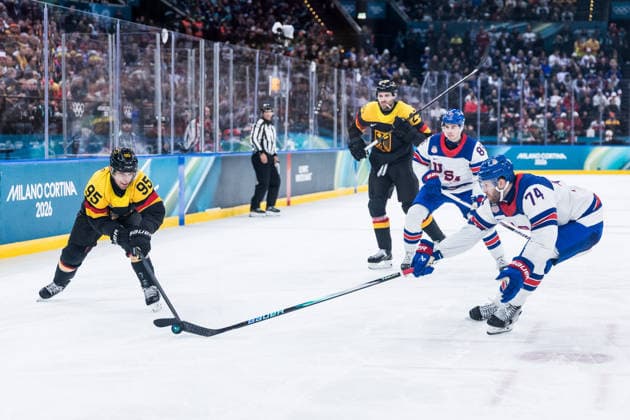 MILANO, ITALY - FEBRUARY 15: Frederik Tiffels (Germany, 95) controls the puck against Jaccob Slavin (United States of America, 74) during the Ice hockey, Eishockey Men United States of America vs Germany - Preliminary Round - Group C at the Milano Cortina 2026 Olympics at Milano Santagiulia Ice Hockey Arena on day 9 of the Milano Cortina 2026 Olympics on February 15, 2026 in Milano, Italy. Editorial use only. Italy Copyright: xSteffiexWunderlx