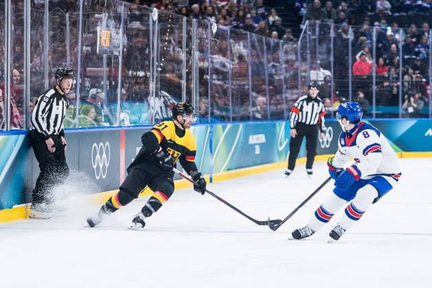 MILANO, ITALY - FEBRUARY 15: Moritz Mueller (Germany, 91) controls the puck against Zach Werenski (United States of America, 8) during the Ice hockey, Eishockey Men United States of America vs Germany - Preliminary Round - Group C at the Milano Cortina 2026 Olympics at Milano Santagiulia Ice Hockey Arena on day 9 of the Milano Cortina 2026 Olympics on February 15, 2026 in Milano, Italy. Editorial use only. Italy Copyright: xSteffiexWunderlx