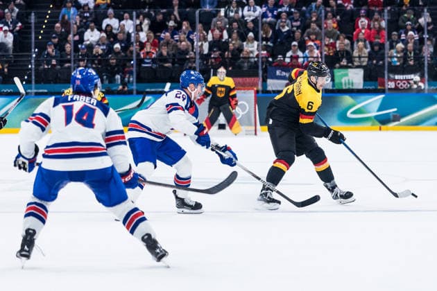 MILANO, ITALY - FEBRUARY 15: Kai Wissmann (Germany, 6) controls the puck against Brock Nelson (United States of America, 29) during the Ice hockey, Eishockey Men United States of America vs Germany - Preliminary Round - Group C at the Milano Cortina 2026 Olympics at Milano Santagiulia Ice Hockey Arena on day 9 of the Milano Cortina 2026 Olympics on February 15, 2026 in Milano, Italy. Editorial use only. Italy Copyright: xSteffiexWunderlx