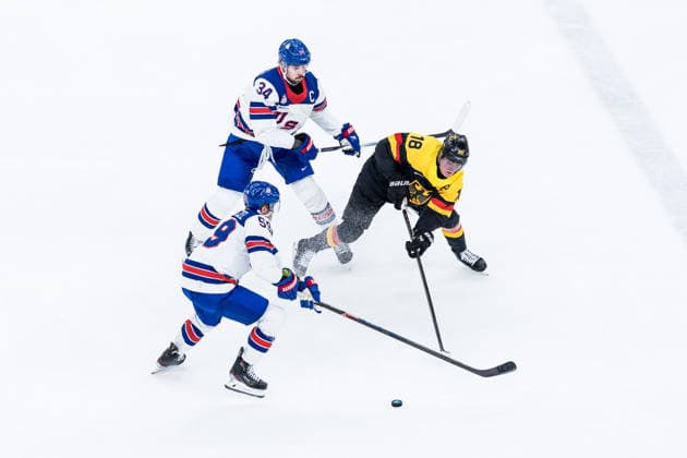 MILANO, ITALY - FEBRUARY 15: Jake Guentzel (United States of America, 59) and Tim Stuetzle (Germany, 18) fight for the puck during the Ice hockey, Eishockey Men United States of America vs Germany - Preliminary Round - Group C at the Milano Cortina 2026 Olympics at Milano Santagiulia Ice Hockey Arena on day 9 of the Milano Cortina 2026 Olympics on February 15, 2026 in Milano, Italy. Editorial use only. Italy Copyright: xSteffiexWunderlx