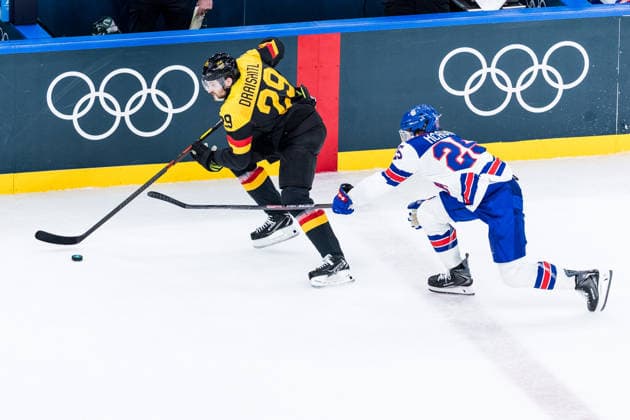 MILANO, ITALY - FEBRUARY 15: Leon Draisaitl (Germany, 29) controls the puck against Charlie McAvoy (United States of America, 25) during the Ice hockey, Eishockey Men United States of America vs Germany - Preliminary Round - Group C at the Milano Cortina 2026 Olympics at Milano Santagiulia Ice Hockey Arena on day 9 of the Milano Cortina 2026 Olympics on February 15, 2026 in Milano, Italy. Editorial use only. Italy Copyright: xSteffiexWunderlx