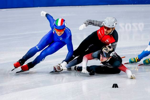 Pietro Sighel of Italy and crash Furkan Akar of Turkiye and Reinis Berzins of Latvia Men s 500m, Milano Cortina 2026 Winter Olympics: Day 10, Short Track Speed skating, Eisschnelllauf - Milano Cortina 2026 Winter Olympics: Day 10, Milano Speed Skating Stadium, February 16, 2026, Milan, Italy.