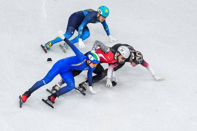 2026 Winter Olympic Games, Olympische Spiele, Olympia, OS MILAN, ITALY - FEBRUARY 16: Turkiye s short track speed skater Furkan Akar, Italian Luca Spechenhauser (3), Kazakh Abzal Azhgaliyev (50), and Latvian Reinis Berzins compete in the men’s 500 meters short track Speed skating, Eisschnelllauf during the Milano-Cortina 2026 Winter Olympic Games in Milan, Italy, on February 16, 2026. Cemal Yurttas Anadolu Milan Italy. Editorial use only. Please get in touch for any other usage.  Copyright: x2026xAnadoluxCemalxYurttasx
