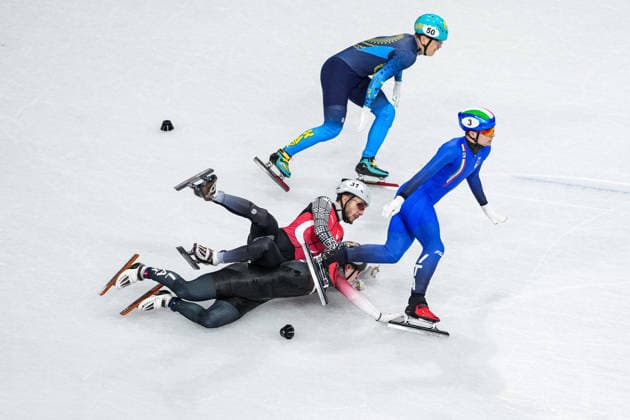 2026 Winter Olympic Games, Olympische Spiele, Olympia, OS MILAN, ITALY - FEBRUARY 16: Turkiye s short track speed skater Furkan Akar, Italian Luca Spechenhauser (3), Kazakh Abzal Azhgaliyev (50), and Latvian Reinis Berzins compete in the men’s 500 meters short track Speed skating, Eisschnelllauf during the Milano-Cortina 2026 Winter Olympic Games in Milan, Italy, on February 16, 2026. Cemal Yurttas Anadolu Milan Italy. Editorial use only. Please get in touch for any other usage.  Copyright: x2026xAnadoluxCemalxYurttasx