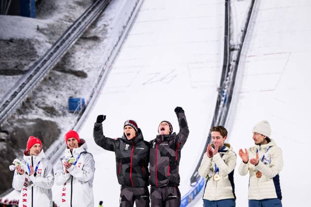 260216 Silver medalists Pawel Wasek and Tomasiak Kacper, gold medalists Jan Hoerl and Stephan Embacher and bronze medalists Kristoffer Eriksen Sundal and Johann Andre Forfang of Norway celebrate on the podium after the men s super team large hill skiing jumping third round during day 10 of the 2026 Winter Olympics on February 16, 2026 in Predazzo. Photo: Maxim Thore BILDBYRAN kod MT MT0989 skidor cross-country skiing langrenn Olympic Games, Olympische Spiele, Olympia, OS olympics winter olympics os ol olympiska spel vinter-os olympiske leker milano cortina 2026 milan cortina 2026 milano cortina 2026 olympic games milano cortina 2026 winter olympic games milano cortina-os milano cortina-ol vinter-ol 10 bbeng jubel Bronze brons Norway norge *** 260216 Silver medalists Pawel Wasek and Tomasiak Kacper, gold medalists Jan Hoerl and Stephan Embacher and bronze medalists Kristoffer Eriksen Sundal and Johann Andre Forfang of Norway celebrate on the podium after the men s super team large hill skiing jumping third round during day 10 of the 2026 Winter Olympics on February 16, 2026 in Predazzo Photo Maxim Thore BILDBYRAN kod MT MT0989 skidor cross country skiing langrenn olympic games olympics winter olympics os ol olympiska spel vinter os olympiske leker milano cortina 2026 milan cortina 2026 milano cortina 2026 olympic games milano cortina 2026 winter olympic games milano cortina os milano cortina ol vinter ol 10 bbeng jubel Bronze brons Norway norge  Copyright: MAXIMxTHORE BB260216MT018