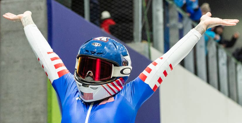 February 16, 2026, Cortina D ampezzo, Lombardy, Italy: Bronze medal winner Kaillie Armbruster Humphries of the USA celebrates the Women s Monobob at the Cortina Sliding Centre for the Milano Cortina 2026 Winter Olympics. Armbruster Humphries is holding her son Aulden. Cortina D ampezzo Italy - ZUMAsc5_ 20260216_oly_sc5_009 Copyright: xErichxSchlegelx
