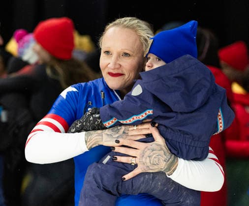 February 16, 2026, Cortina D ampezzo, Lombardy, Italy: Bronze medal winner Kaillie Armbruster Humphries of the USA holds her son Aulden after the Women s Monobob at the Cortina Sliding Centre for the Milano Cortina 2026 Winter Olympics. Armbruster Humphries is holding her son Aulden. Cortina Sliding Centre - Monnobob  - ZUMAsc5_ 20260216_oly_sc5_007 Copyright: xErichxSchlegelx