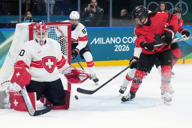 February 16, 2026, Milan, ITALY: Canada s Jocelyne Larocque (3) misses her shot on an open net as Switzerland s Andrea Braendli (20) looks on during first period women s Olympic semifinal hockey action at the 2026 Milan Cortina Winter Olympics in Milan, Monday, Feb. 16, 2026. Canada News - February 16, 2026  - ZUMAc35_ 20260216_zaf_c35_179 Copyright: xNathanxDenettex