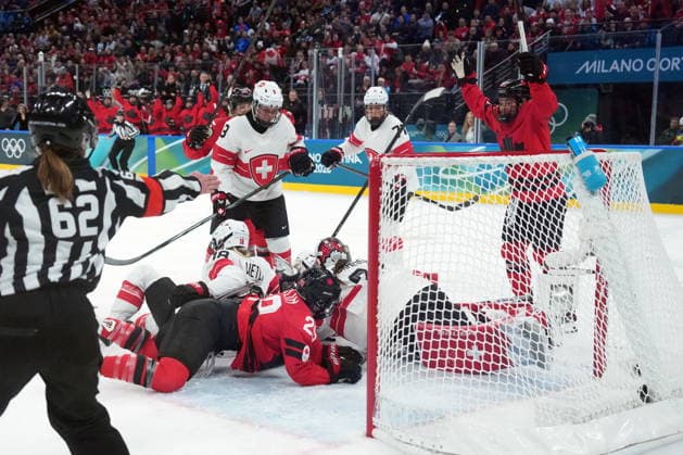 February 16, 2026, Milan, ITALY: Canada s Marie-Philip Poulin (29) scores past Switzerland s Andrea Braendli (20) during second period women s Olympic semifinal hockey action at the 2026 Milan Cortina Winter Olympics in Milan, Monday, Feb. 16, 2026. Canada News - February 16, 2026  - ZUMAc35_ 20260216_zaf_c35_191 Copyright: xNathanxDenettex