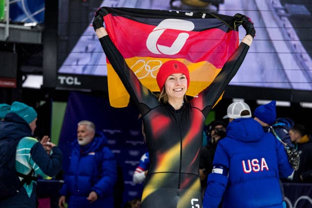 CORTINA, ITALY - FEBRUARY 16: Laura Nolte (Germany) smiles holding a German flag after the Bobsleigh Women s Monobob at the Milano Cortina 2026 Olympics at Cortina Sliding Centre on day 10 of the Milano Cortina 2026 Olympics on February 16, 2026 in Cortina, Italy. Editorial use only. Italy Copyright: xSteffiexWunderlx