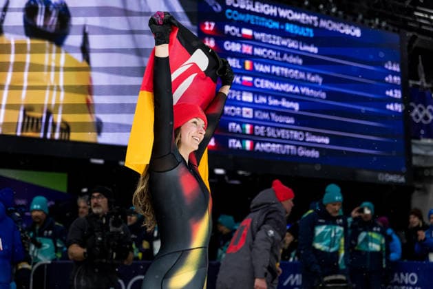 CORTINA, ITALY - FEBRUARY 16: Laura Nolte (Germany) smiles holding a German flag after the Bobsleigh Women s Monobob at the Milano Cortina 2026 Olympics at Cortina Sliding Centre on day 10 of the Milano Cortina 2026 Olympics on February 16, 2026 in Cortina, Italy. Editorial use only. Italy Copyright: xSteffiexWunderlx