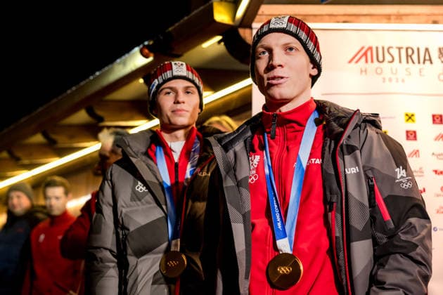 OLYMPICS - Winter Olympic Games, Olympische Spiele, Olympia, OS Milano Cortina 2026 PREDAZZO,ITALY,16.FEB.26 - OLYMPICS, Ski jumping, Skispringen, Ski, nordisch - Winter Olympic Games Milano Cortina 2026, large hill, Super Team, men, reception for medalists. Image shows Jan Hoerl and Stephan Embacher (AUT).  GEPAxpictures xMatthiasxTrinkl