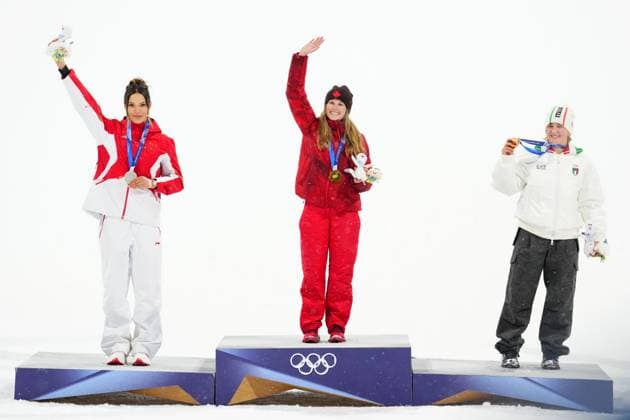 February 16, 2026, Livigno, Italy: Canada s Megan Oldham celebrates her gold medal on the podium flanked by silver medalist Eileen Gu, of China, left, and bronze medalist Flora Tabanelli, of Italy, following the women s free ski big air final at the Milano Cortina 2026 Winter Olympic Games, Olympische Spiele, Olympia, OS in Livigno, Italy, Monday, Feb. 16, 2026. Canada News - February 16, 2026  - ZUMAc35_ 20260216_zaf_c35_256 Copyright: xSeanxKilpatrickx