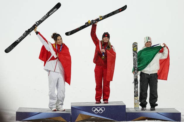 LIVIGNO, ITALY - FEBRUARY 16: Gold medalist Megan Oldham (C) of Team Canada celebrates on the podium with silver medalist Eileen Gu Ailing (L) of Team China and bronze medalist Flora Tabanelli of Team Italy during the medal ceremony for the Women s Freeski Big Air Final on day ten of the Milano Cortina 2026 Winter Olympic Games, Olympische Spiele, Olympia, OS at Livigno Snow Park on February 16, 2026 in Livigno, Italy.  Copyright: xCHINASPORTSx 111621938946