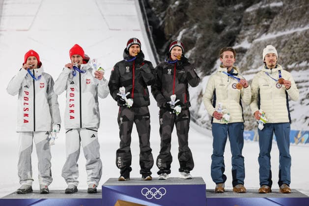 (260217) -- PREDAZZO, Feb. 17, 2026 -- Gold medalist Team Austria (C), Silver medalist Team Poland (L) and Bronze medalist Team Norway pose on the podium after the Ski jumping, Skispringen, Ski, nordisch men s super team event at the Milan-Cortina 2026 Olympic Winter games, Winterspiele,Spiele, Summer games in Predazzo, Italy, Feb. 16, 2026. ) (MICO2026)ITALY-PREDAZZO-OLYMPIC WINTER GAMES-SKI JUMPING-MEN S SUPER TEAM HuangxWei 