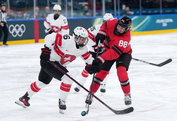 (260217) -- MILAN, Feb. 17, 2026 -- Canada s Julia Gosling (88) battles for the puck with Switzerland s Nicole Vallario during the Play-offs Semifinals match between Canada and Switzerland of Ice hockey, Eishockey Women at the Milan-Cortina 2026 Olympic Winter games, Winterspiele,Spiele, Summer games in Milan, Italy, Feb. 16, 2026. ) (MICO2026)ITALY-MILAN-OLYMPIC WINTER GAMES-ICE HOCKEY-WOMEN-PLAY-OFFS SEMIFINALS-CAN VS SUI SunxFei 