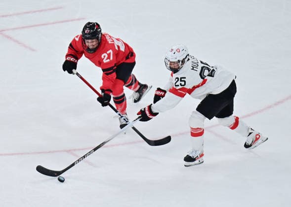 (260217) -- MILAN, Feb. 17, 2026 -- Switzerland s Alina Muller (25) battles for the puck with Canada s Emma Maltais during the Play-offs Semifinals match between Canada and Switzerland of Ice hockey, Eishockey Women at the Milan-Cortina 2026 Olympic Winter games, Winterspiele,Spiele, Summer games in Milan, Italy, Feb. 16, 2026. ) (MICO2026)ITALY-MILAN-OLYMPIC WINTER GAMES-ICE HOCKEY-WOMEN-PLAY-OFFS SEMIFINALS-CAN VS SUI TaoxXiyi 