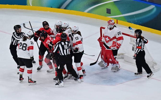 (260217) -- MILAN, Feb. 17, 2026 -- Canada s Marie-Philip Poulin(29) clashes with Switzerland s players during the Play-offs Semifinals match between Canada and Switzerland of Ice hockey, Eishockey Women at the Milan-Cortina 2026 Olympic Winter games, Winterspiele,Spiele, Summer games in Milan, Italy, Feb. 16, 2026. ) (MICO2026)ITALY-MILAN-OLYMPIC WINTER GAMES-ICE HOCKEY-WOMEN-PLAY-OFFS SEMIFINALS-CAN VS SUI TaoxXiyi 