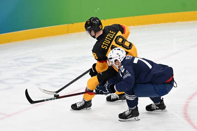 Winter Olympics - Ice hockey, Eishockey - Men - France v Germany Jordann Perret (72) of Team France, Tim Stutzle (18) of Team Germany during the men s qualification play-off ice hockey match between Germany and France at the Milano Santagiulia Ice Hockey Arena during the Milano Cortina 2026 Winter Olympic Games, Olympische Spiele, Olympia, OS in Milan, on February 17, 2026. Photo by JMP ABACAPRESS.COM Milan Italy  Copyright: xJMP ABACAx