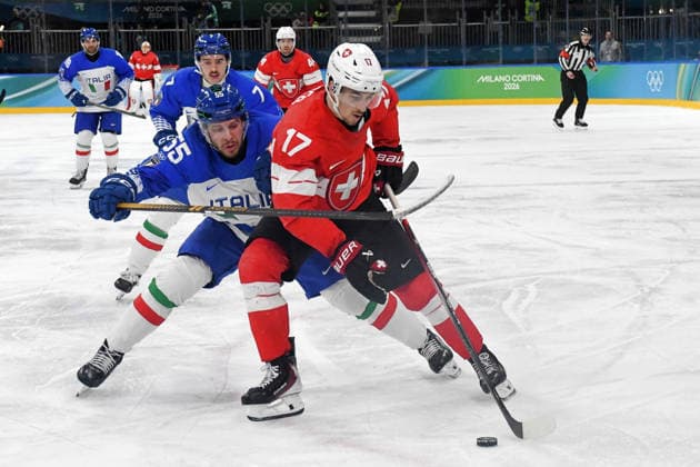 Ken Jager (Suisse) against Luca Zanatta (Italy) during Ice hockey, Eishockey Olympic Winter games, Winterspiele,Spiele, Summer games Milano-Cortina 2026 in Milano, Italy, February 17 2026  Copyright: xPasqualexGolia IPAxSportx xipa-agency.netx xx IPA_71638700 IPA_Agency_IPA71638700