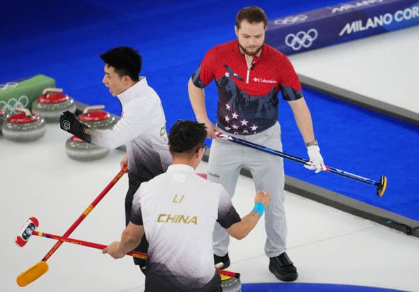 (260217) -- CORTINA D AMPEZZO, Feb. 17, 2026 -- Fei Xueqing (L) and Li Zhichao (C) of China celebrates after the curling men s round robin session 9 match between China and the United States at the 2026 Milan-Cortina Winter Olympics in Cortina, Italy, Feb. 17, 2026. ) (MICO2026)ITALY-CORTINA D AMPEZZO-OLYMPIC Winter games, Winterspiele,Spiele, Summer games CURLING-MEN-ROUND ROBIN-CHN VS USA LixGang 