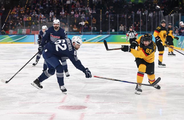 (260217) -- MILAN, Feb. 17, 2026 -- Marc Michaelis (R, front) of Germany vies with Florian Chakiachvili (L, front) of France during the Ice hockey, Eishockey men s qualification play-off match between Germany and France at the Milan-Cortina 2026 Olympic Winter games, Winterspiele,Spiele, Summer games in Milan, Italy, Feb. 17, 2026. ) (MICO2026)ITALY-MILAN-OLYMPIC WINTER GAMES-ICE HOCKEY-MEN-QUALIFICATION PLAY-OFF-GER VS FRA WangxKaiyan 