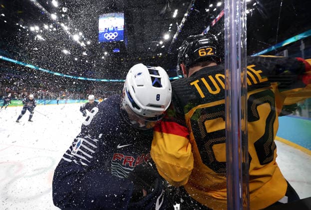 (260217) -- MILAN, Feb. 17, 2026 -- Hugo Gallet (L) of France and Parker Tuomie of Germany clash during the Ice hockey, Eishockey men s qualification play-off match between Germany and France at the Milan-Cortina 2026 Olympic Winter games, Winterspiele,Spiele, Summer games in Milan, Italy, Feb. 17, 2026. ) (MICO2026)ITALY-MILAN-OLYMPIC WINTER GAMES-ICE HOCKEY-MEN-QUALIFICATION PLAY-OFF-GER VS FRA WangxKaiyan 