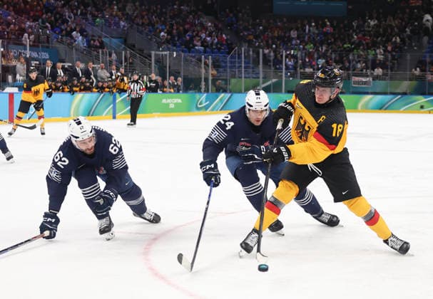 (260217) -- MILAN, Feb. 17, 2026 -- Tim Stutzle (R) of Germany vies with Justin Addamo (C) of France during the Ice hockey, Eishockey men s qualification play-off match between Germany and France at the Milan-Cortina 2026 Olympic Winter games, Winterspiele,Spiele, Summer games in Milan, Italy, Feb. 17, 2026. ) (MICO2026)ITALY-MILAN-OLYMPIC WINTER GAMES-ICE HOCKEY-MEN-QUALIFICATION PLAY-OFF-GER VS FRA WangxKaiyan 