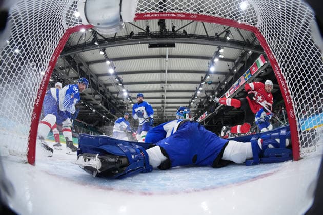 (260217) -- MILAN, Feb. 17, 2026 -- Nino Niederreiter (1st R) of Switzerland shoots during the Ice hockey, Eishockey men s qualification play-off round match between Switzerland and Italy at the Milan-Cortina 2026 Olympic Winter games, Winterspiele,Spiele, Summer games in Milan, Italy, Feb. 17, 2026. ) (MICO2026)ITALY-MILAN-OLYMPIC WINTER GAMES-ICE HOCKEY-MEN-QUALIFICATION PLAY-OFF-SUI VS ITA TaoxXiyi 