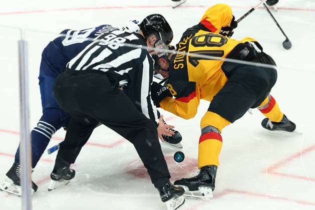 February 17, 2026, Milan, Lombardy, Italy: Face-off during the Play-off game between Team Germany and Team France at the Milano Cortina 2026 Olympic Games, Olympische Spiele, Olympia, OS Milan Italy - ZUMAc179 20260217_oly_c179_061 Copyright: xMickaelxChavetx