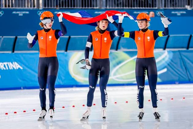 second Joy Beune of the Netherlands and Marijke Groenewoud of the Netherlands and Antoinette Rijpma-De Jong of the Netherlands looks dejected and holding flag after Women s Team Pursuit Finals, Milano Cortina 2026 Winter Olympics: Day 11, Speed skating, Eisschnelllauf - Milano Cortina 2026 Winter Olympics: Day 11, Milano Speed Skating Stadium, February 17, 2026, Milan, Italy.