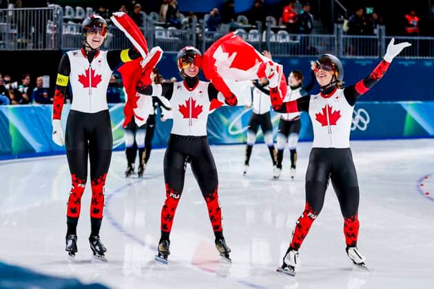 winners Ivanie Blondin of Canada and Valerie Maltais of Canada and Isabelle Weidemann of Canada celebrating and holding flag after Women s Team Pursuit Finals, Milano Cortina 2026 Winter Olympics: Day 11, Speed skating, Eisschnelllauf - Milano Cortina 2026 Winter Olympics: Day 11, Milano Speed Skating Stadium, February 17, 2026, Milan, Italy.