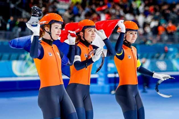 second Joy Beune of the Netherlands and Marijke Groenewoud of the Netherlands and Antoinette Rijpma-De Jong of the Netherlands looks on and holding flag after Women s Team Pursuit Finals, Milano Cortina 2026 Winter Olympics: Day 11, Speed skating, Eisschnelllauf - Milano Cortina 2026 Winter Olympics: Day 11, Milano Speed Skating Stadium, February 17, 2026, Milan, Italy.