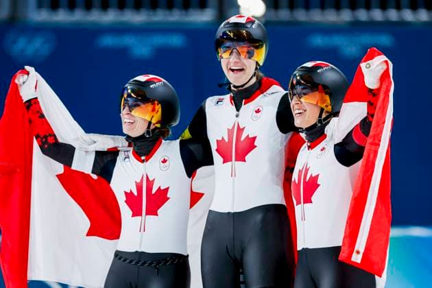 winners Ivanie Blondin of Canada and Valerie Maltais of Canada and Isabelle Weidemann of Canada celebrating and holding flag after Women s Team Pursuit Finals, Milano Cortina 2026 Winter Olympics: Day 11, Speed skating, Eisschnelllauf - Milano Cortina 2026 Winter Olympics: Day 11, Milano Speed Skating Stadium, February 17, 2026, Milan, Italy.